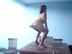 A gorgeous Hispanic woman is sultrily wiggling her ass.